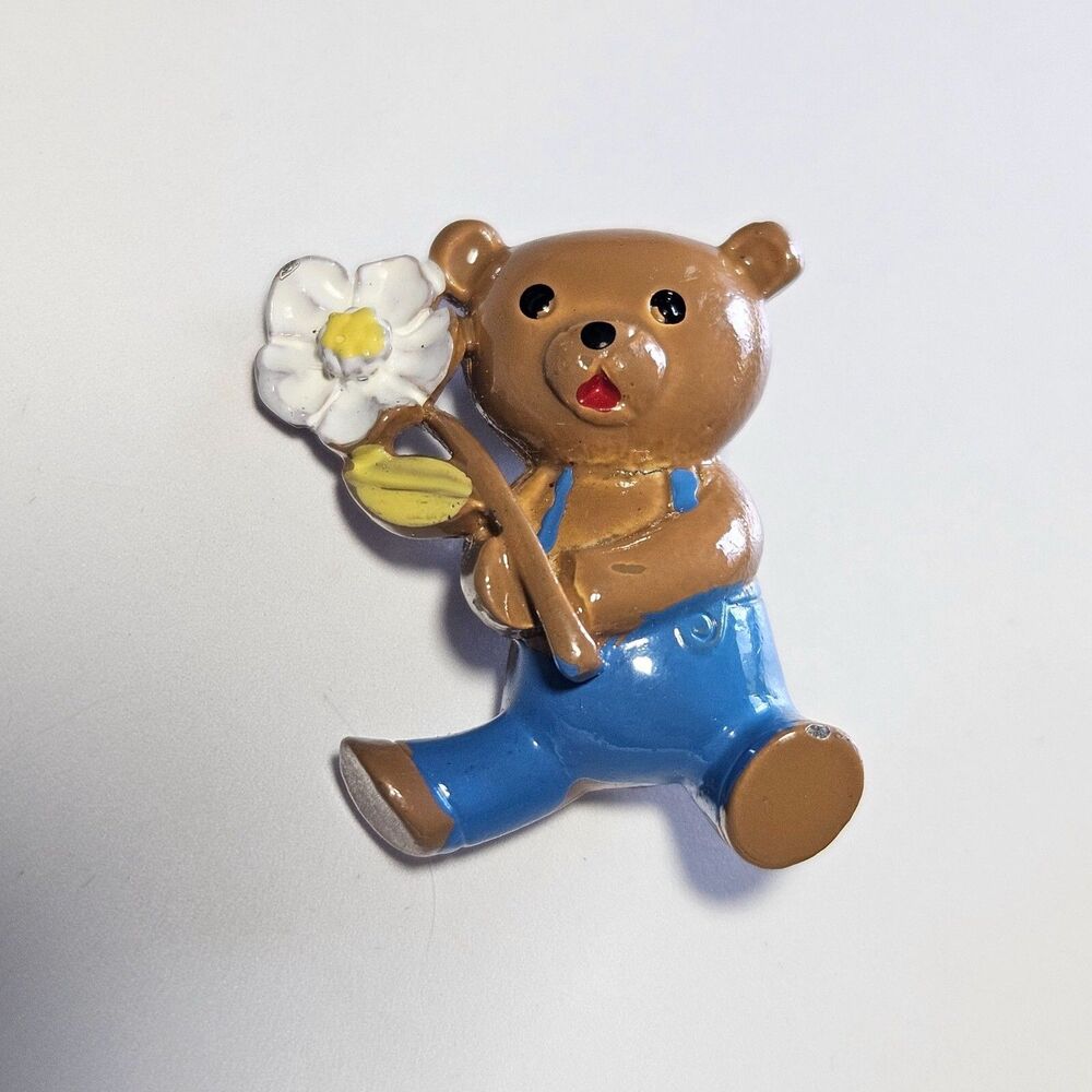 Vintage Painted Metal Brown Bear In Overalls With A Daisy Brooch